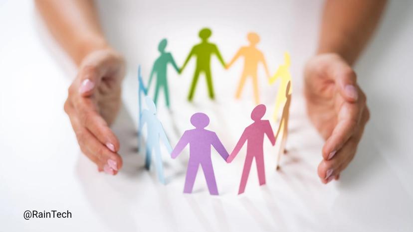 Colorful paper cutout figures holding hands in a circle, surrounded by protective hands.