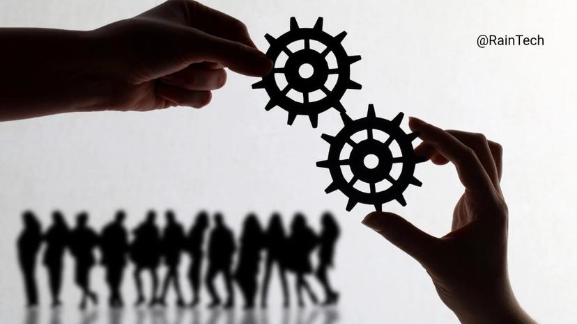 Hands connecting gears symbolizing Indonesian remote team integration and collaboration for startups and established companies.