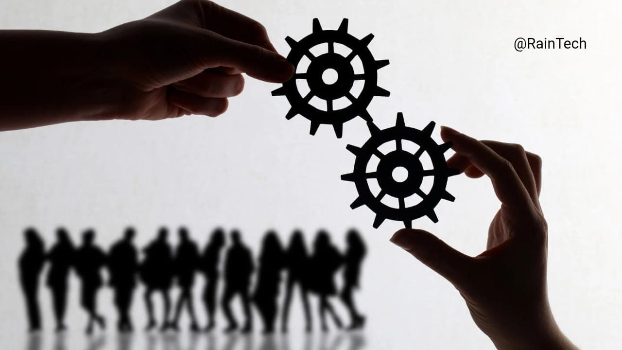Hands connecting gears symbolizing Indonesian remote team integration and collaboration for startups and established companies.