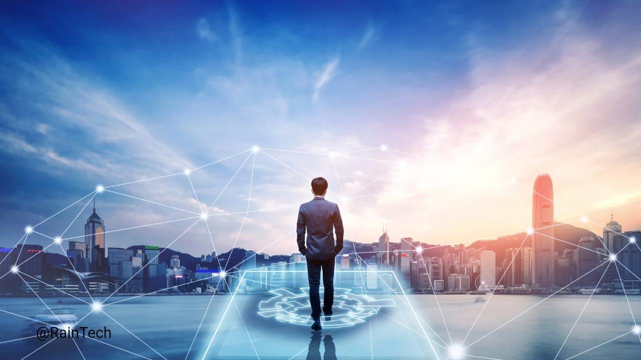 A faceless businessman standing on futuristic digital platform overlooking a city skyline at sunrise, with glowing network connection in the sky.