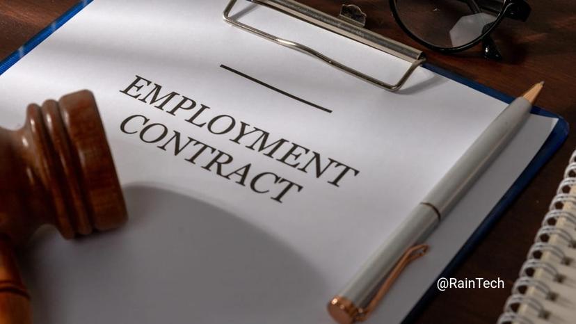 A formal Indonesian employment contract on a clipboard with a gavel and pen, representing legal compliance and BPJS security for tech squads in 2026.